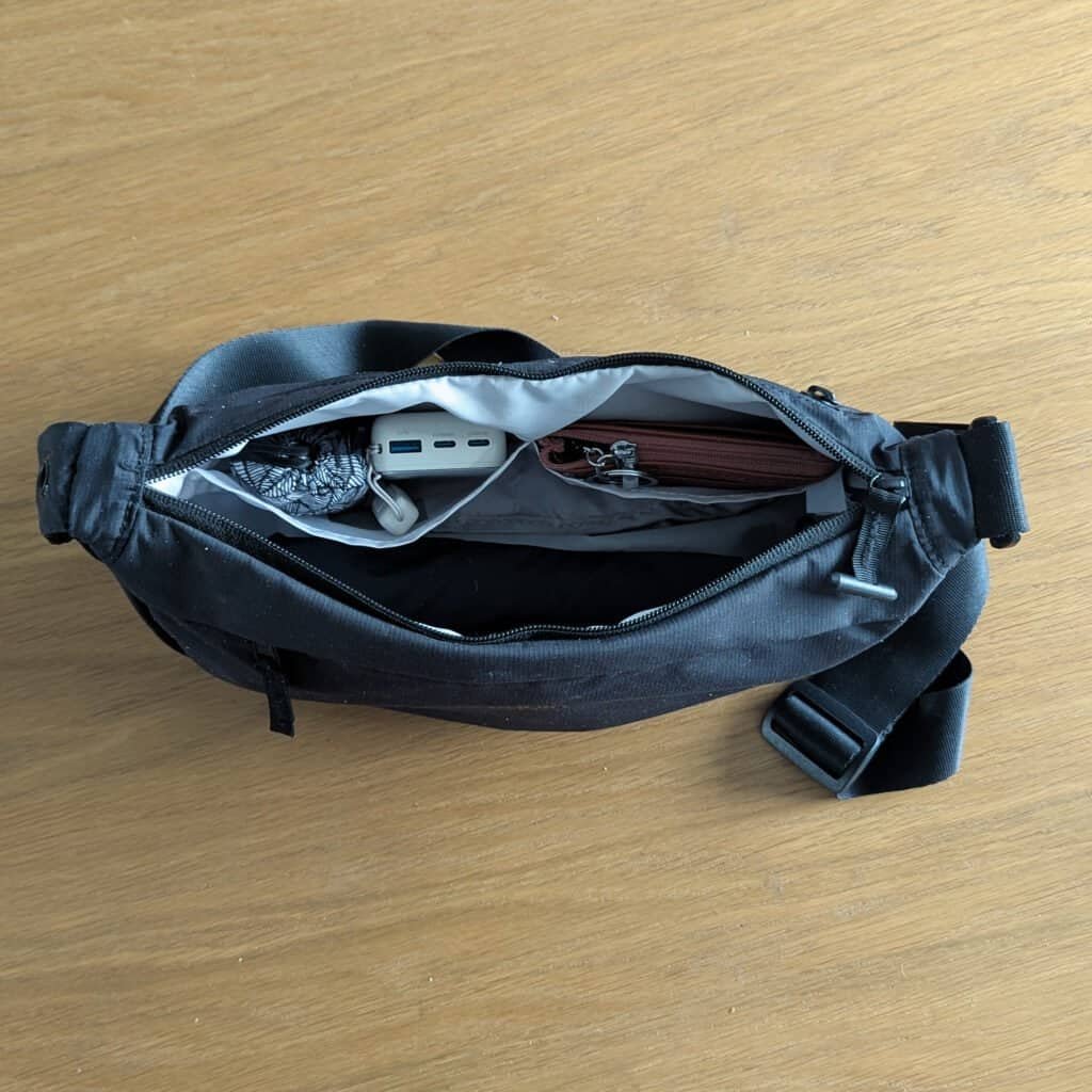 Cabin Zero 5L Moonbag open with ultralight umbrella and nanobag - battery pack - wallet in internal pockets - Upgraded version of Uniqlo viral crescent bag