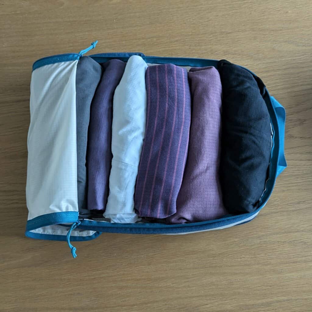 Cabin Zero Large Ultralight Compression Packing Cubes opened with clothes rolled inside