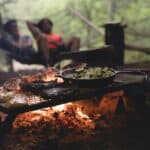 a meal cooking on a camp