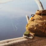 a tackle backpack on the lake dock