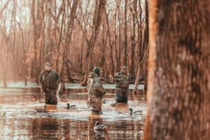 a group hunting outdoors in water