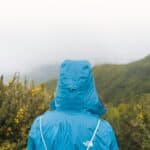 a rain jacket on during a hike