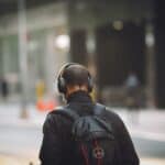a man walking with headphones