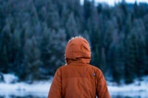 a cold hike forest coat bundled up