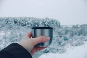 a thermos for water on winter hike