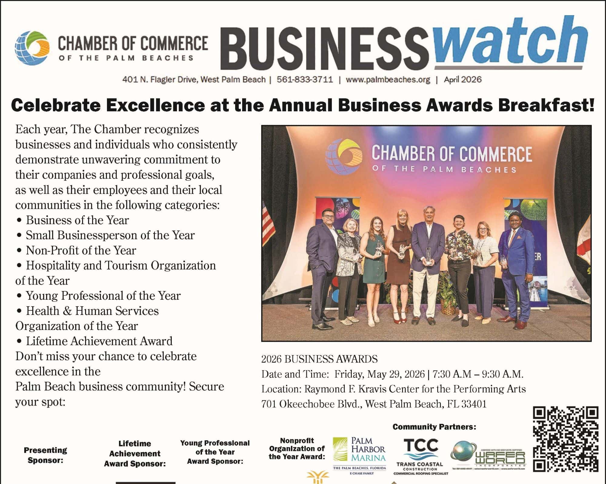 Business awards ceremony with a group photo of winners and organizers.