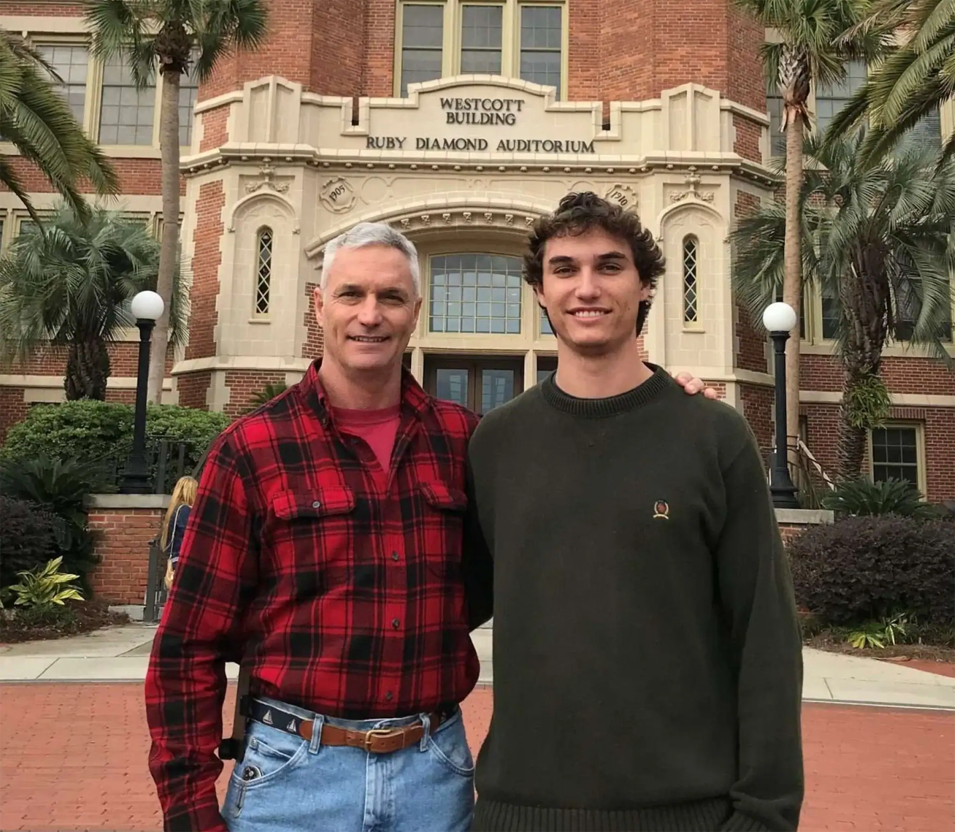 Father and son in front of the Westcott Building.