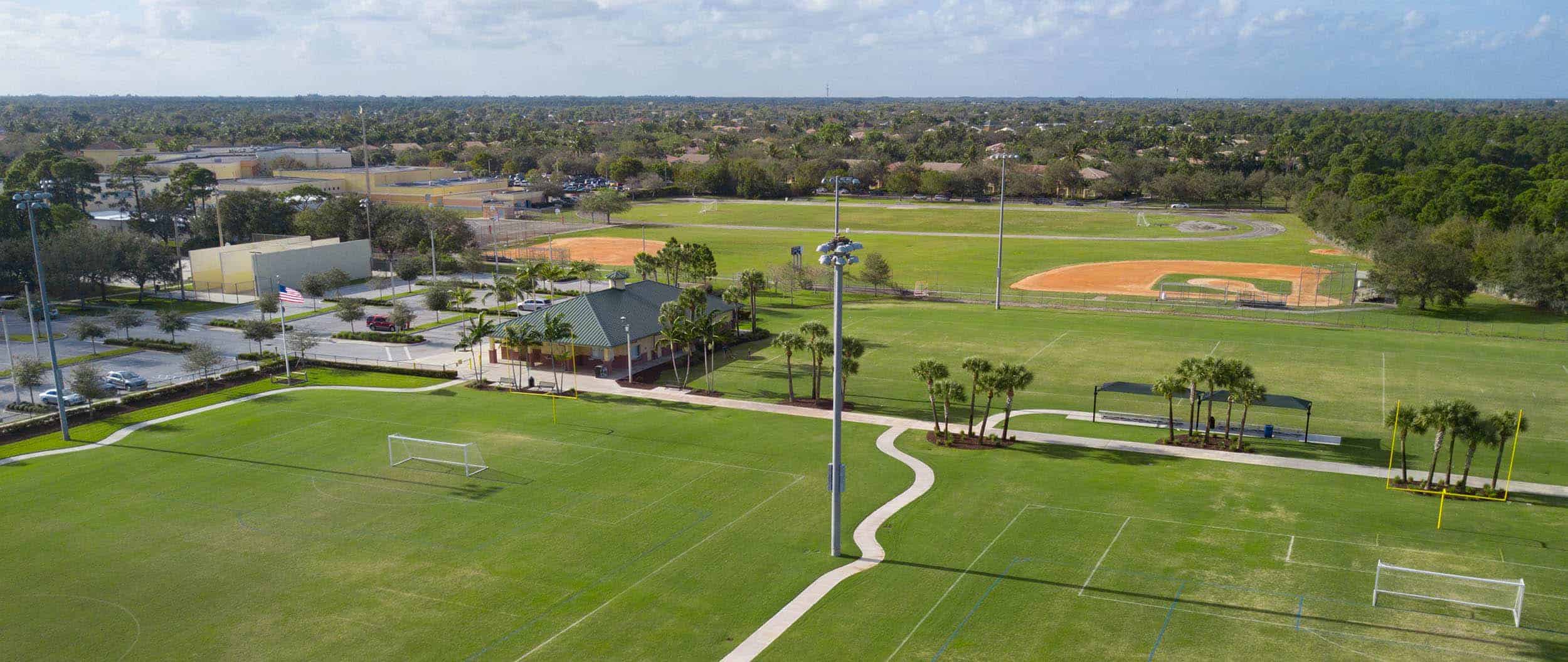 Aerial view of Abacoa Community Park with sports fields and walking paths in Palm Beach County.