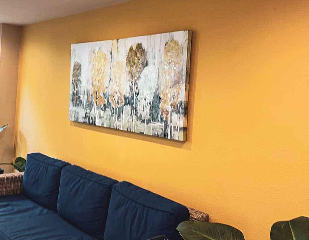 Interior painting with yellow accent wall