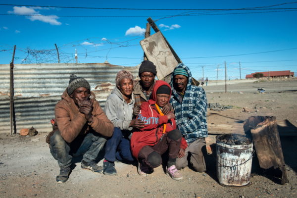 DE AAR, EMTHANJENI - 28 August 2021 - People form an informal settlement near De Aar burn coal and wood to keep warmPhoto: Bram Lammers
