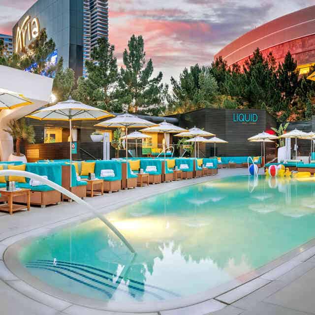 Relaxing pool area with lounge chairs and umbrellas on Partybody.