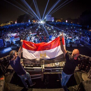 Aly & Fila performing live on Partybody with a large crowd and light show.