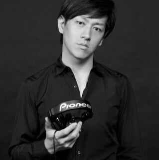 Atsuo Morita holding Pioneer DJ equipment on Partybody.
