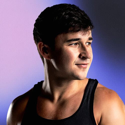 Male model with dark hair in a black tank top on Partybody.