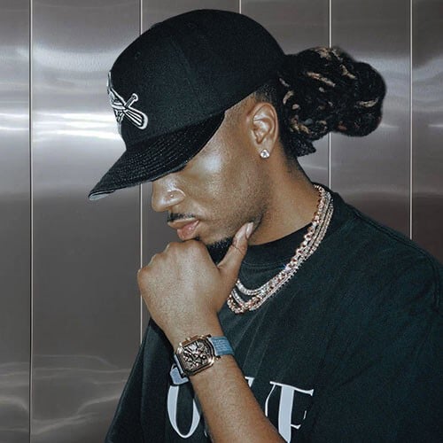 Fashionable man with dreadlocks wearing a cap on Partybody.