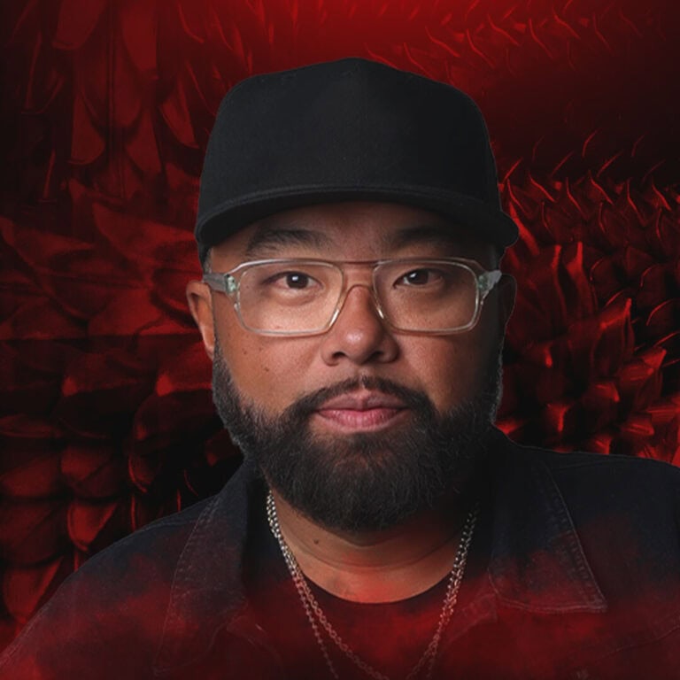 Man wearing a black cap and glasses on Partybody.