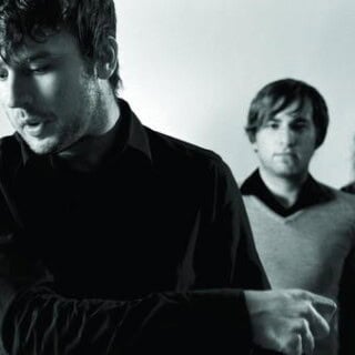 The Postal Service band members performing on Partybody.