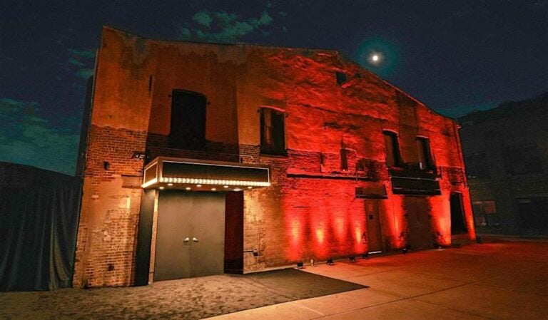 Nightclub exterior illuminated with red lights on Partybody.