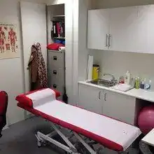 Therapist preparing treatment in a modern physiotherapy clinic in London.