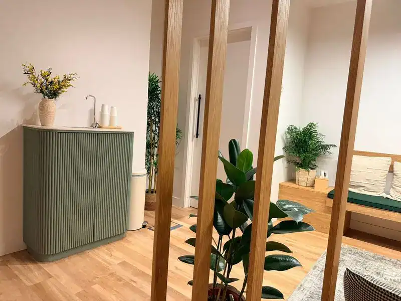 Physio-medicine London clinic reception area with modern decor and comfortable seating.