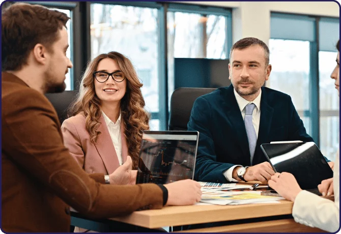 Business meeting introducing the guide to hiring foreign employees after company formation in Bahrain.