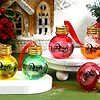 Brightly colored 2oz round plastic bottles with "Drink me" label and red ribbons, perfect for holida.