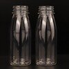 Overall appearance of a food-grade 200ml 7oz transparent round PET juice bottle