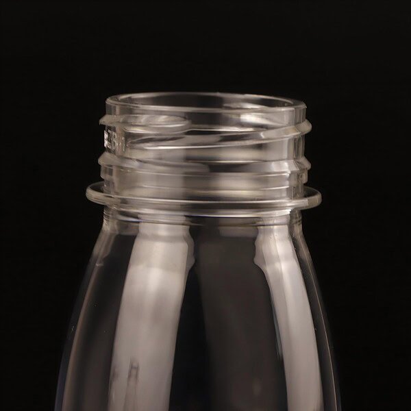 Neck of food-grade 200ml 7oz PET clear round juice bottle