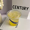 PET cold cups filled with drinks are placed on the bar counter. PET cups are suitable for juice shops, coffee shops, soft drink shops, and bubble tea shops.