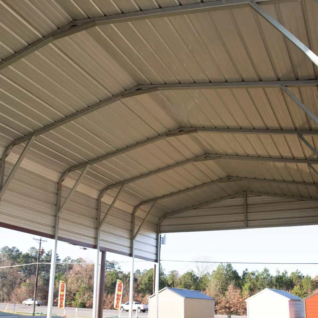 Metal RV cover providing protection for RVs in Texas weather.