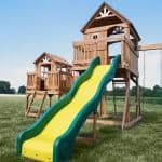 Malibu Swing Set with slide and playhouse for kids in Texas backyard.