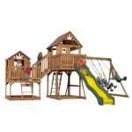 Kids playing on a wooden outdoor playset with slide and swings in Texas.