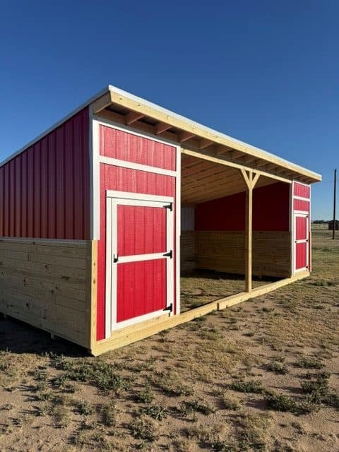 Colorful outdoor loafing shed with red and natural wood finish.