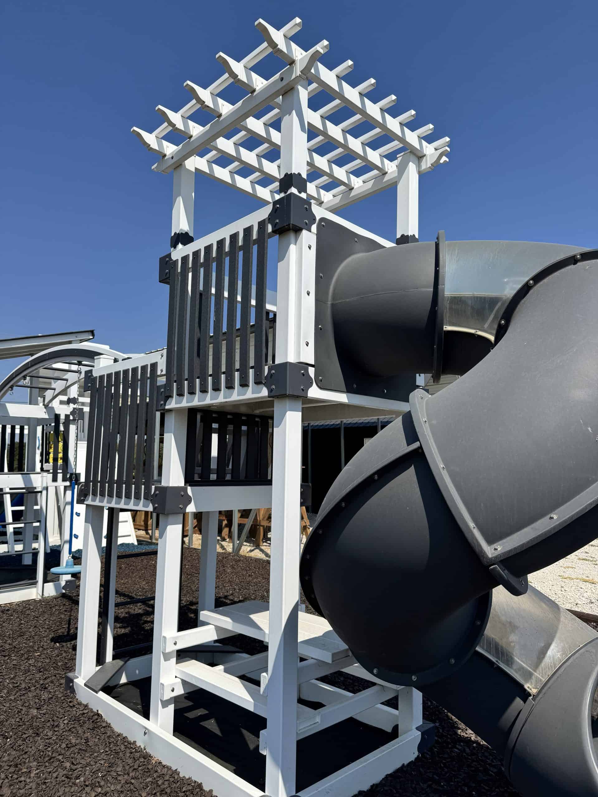 Children's outdoor playset with slide and climbing area in Texas.