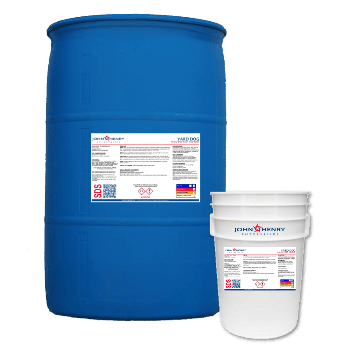 A blue barrel filled with cleaning chemicals, accompanied by a professional pressure washer nearby.