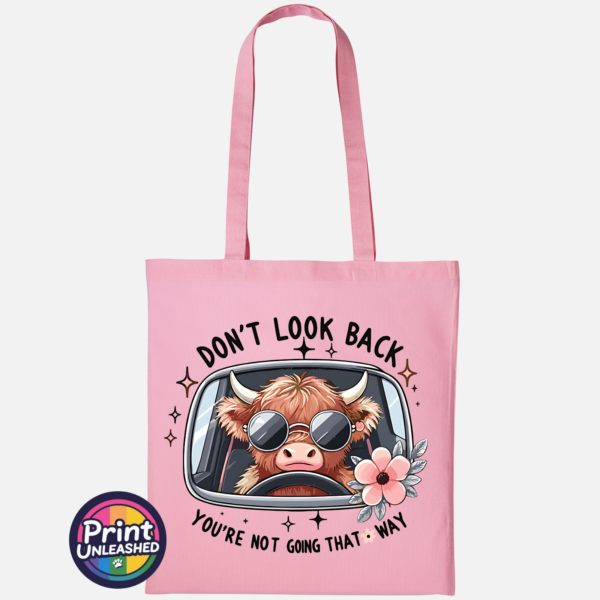 Don't Look Back Highland cow design on cotton tote bag light pink - Print Unleashed