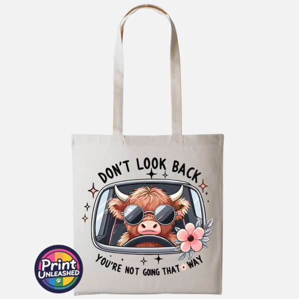 Don't Look Back Highland cow design on cotton tote bag natural - Print Unleashed