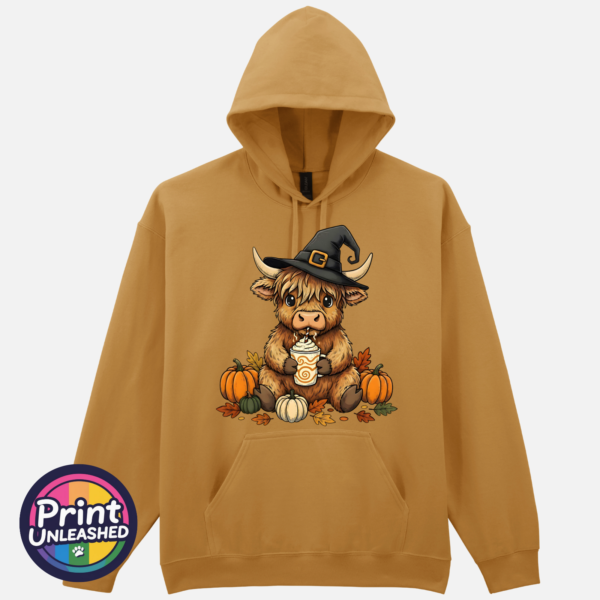 Highland Cow Witch with pumpkins and autumn drink on Softstyle hoodie in mustard - Print Unleashed