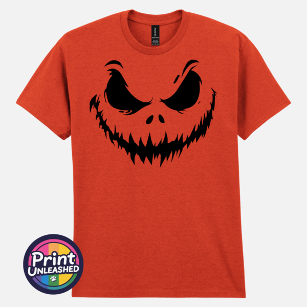 Scowling pumpkin face with arched eyebrows and a jagged grin on a Texas Orange unisex T-shirt - Print Unleashed
