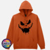 Cracked pumpkin face with scowling eyes and a wide fanged mouth on a Texas Orange Softstyle Hoodie - Print Unleashed