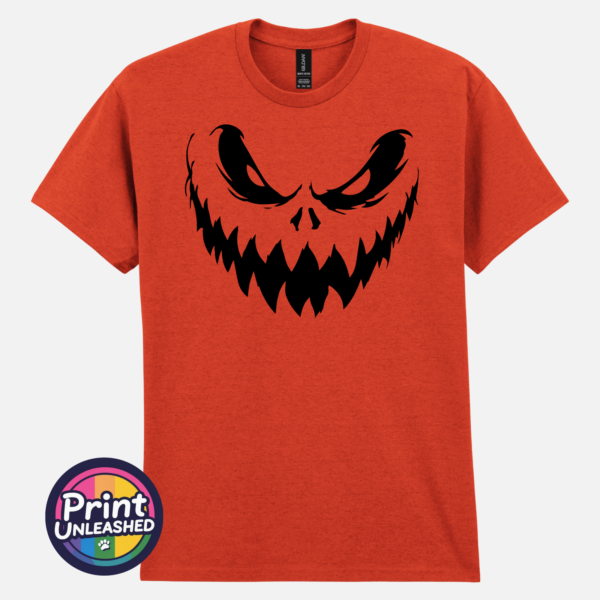 Sinister pumpkin face with narrowed eyes and sharp jagged teeth on a Texas Orange unisex T-shirt - Print Unleashed