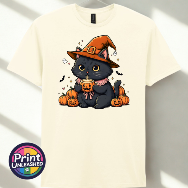 Black Cat off white Cute black cat wearing an orange witch hat and pink collar, holding a steaming pumpkin mug among pumpkins, tiny ghosts and bats, printed on a unisex T-shirt off white - Print Unleashed