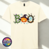 Halloween BOO design with tangled vines, a witch-hat pumpkin, ghosts and a spooky tree printed on a unisex T-shirt off white - Print Unleashed