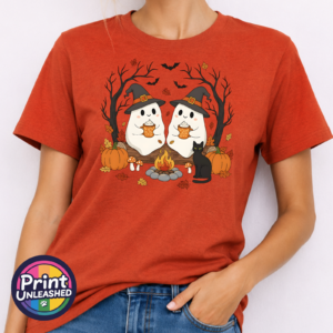 Camping Ghosts ant ora model Two ghosts in witch hats holding orange mugs beside a campfire, with a black cat, pumpkins and autumn trees, printed on a unisex T-shirt antique orange model - Print Unleashed