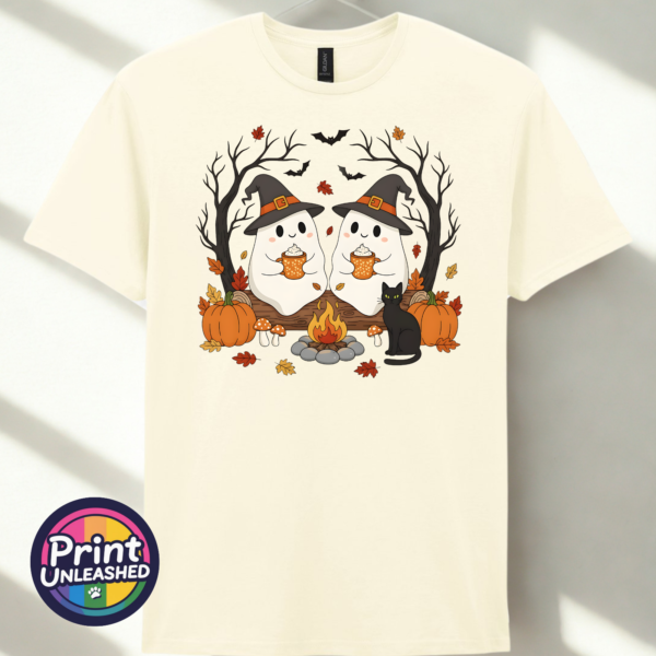 Camping Ghosts off white Two ghosts in witch hats holding orange mugs beside a campfire, with a black cat, pumpkins and autumn trees, printed on a unisex T-shirt off white - Print Unleashed
