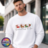 Four dachshunds dressed as Santa, a reindeer, an elf and a snowman above Dachshund Through the Snow wording, printed on a white unisex sweatshirt male model - Print Unleashed