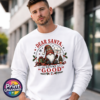 Christmas gonk holding an I Tried sign beside presents and a small tree, with Dear Santa Define Good wording, printed on a white unisex sweatshirt male model - Print Unleashed