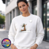 Fox wearing a crown of holly and berries gazing at a full moon from a snowy hill, printed on a white unisex sweatshirt female model - Print Unleashed