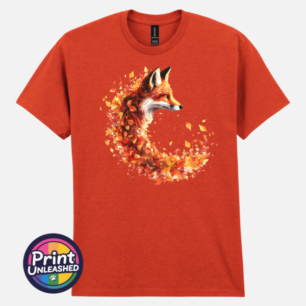 Fox in profile with its russet fur blending into a sweeping curve of orange, red and golden autumn leaves printed on a unisex T-shirt antique orange - Print Unleashed