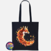 Fox in profile with its russet fur blending into a sweeping curve of orange, red and golden autumn leaves printed on a tote bag black - Print Unleashed